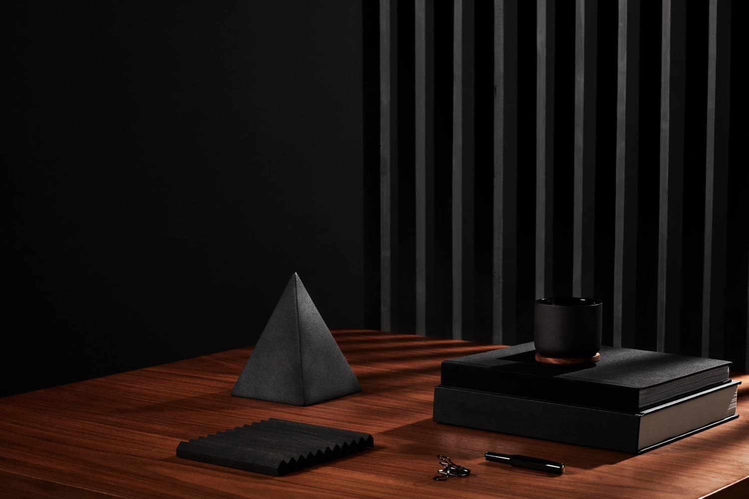 Sculptural objects arranged in a softly lit studio